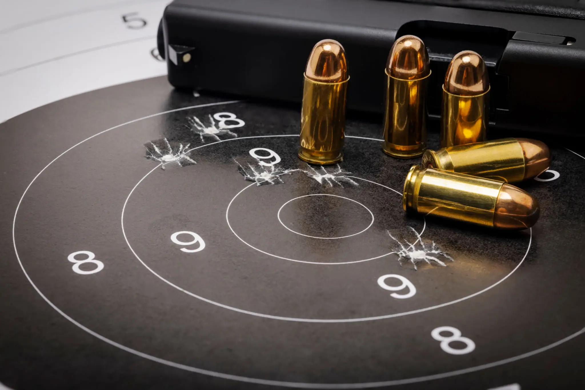 shooting target with bullets standing upright on it